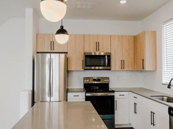 Light open kitchen with energy efficient appliances